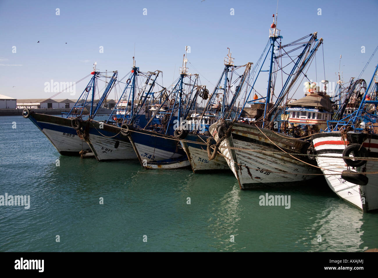 Agadir fishing port, Morocco, North West Africa. Blue Fishing boats in harbour. Petit Port de peche Stock Photo