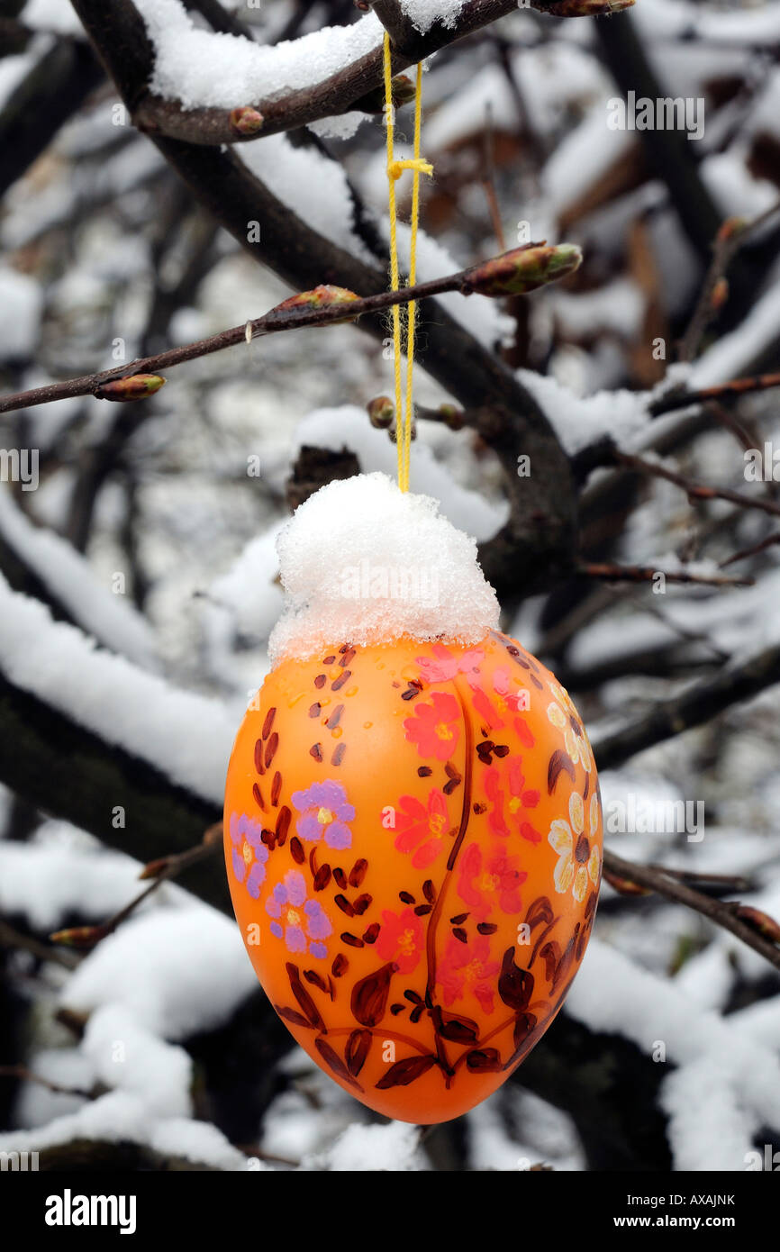 easter egg covered with snow Osterei mit Schnee Stock Photo
