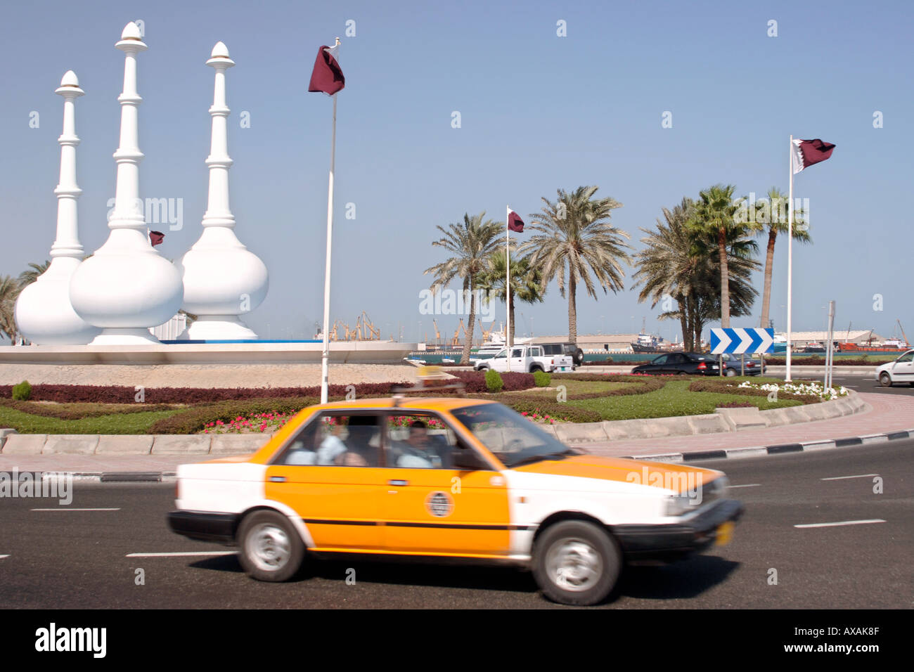 Monument in the shape of perfume bottles on a roundabout in Doha in ...