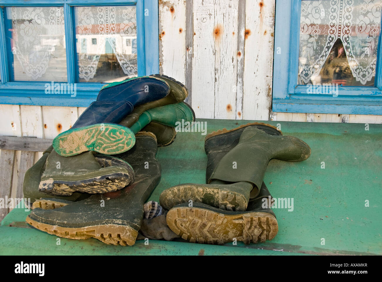 Rubber boots in front of a fishing hut Stock Photo