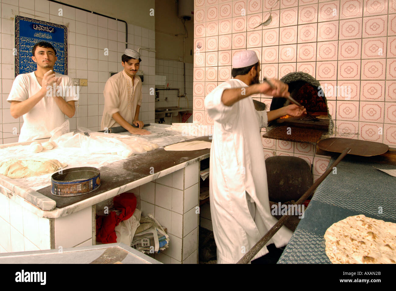 Men preparing bread in a Dubai bakery Stock Photo Alamy