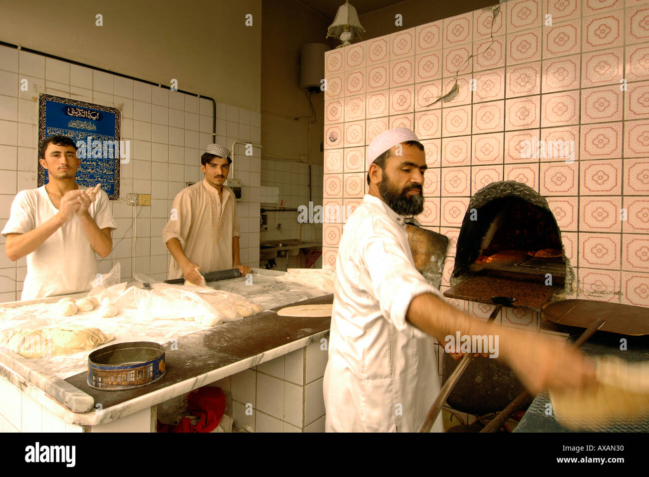 Men preparing bread in a Dubai bakery Stock Photo Alamy