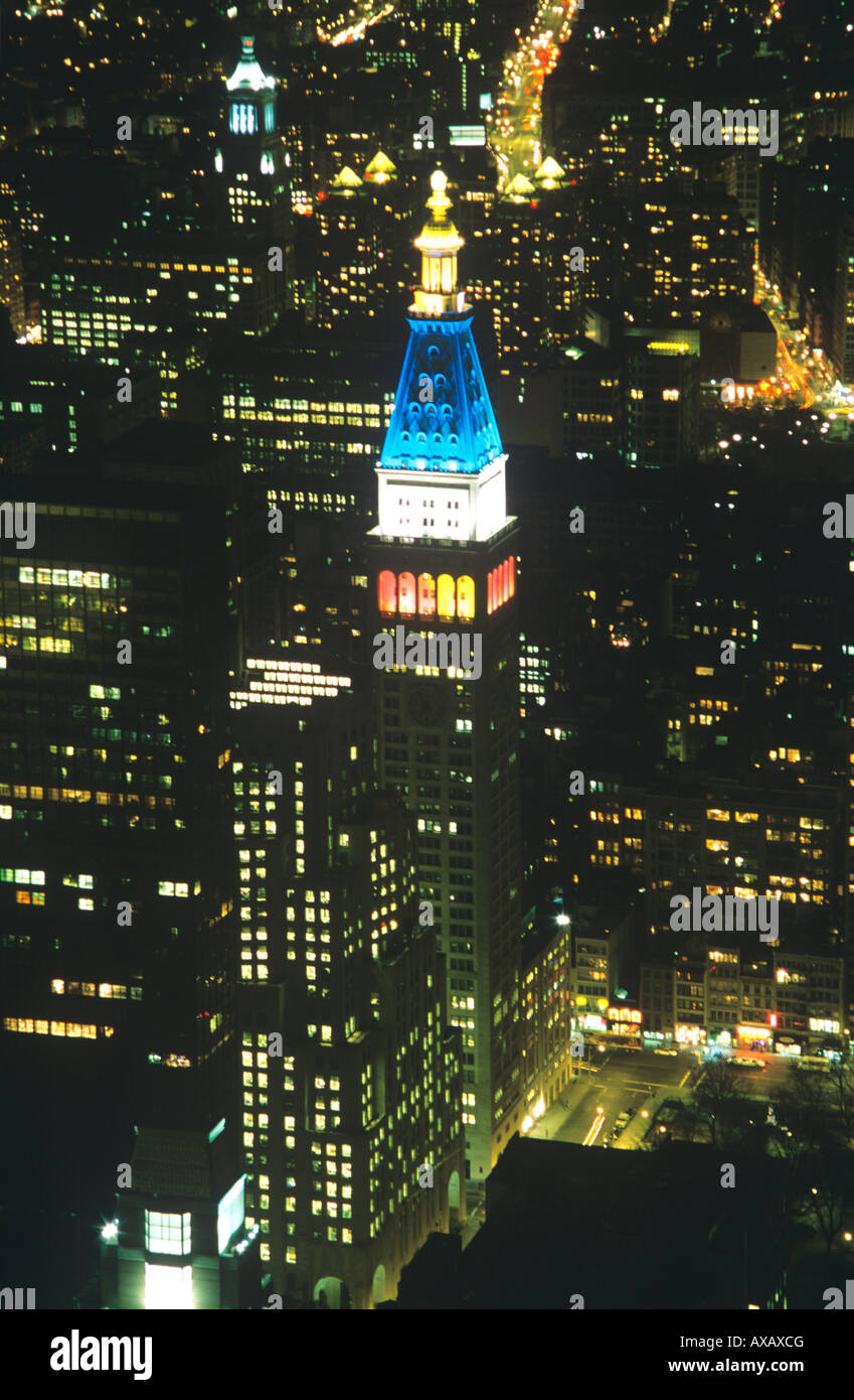 Manhattan Skyscraper illuminated at Night. Stock Photo