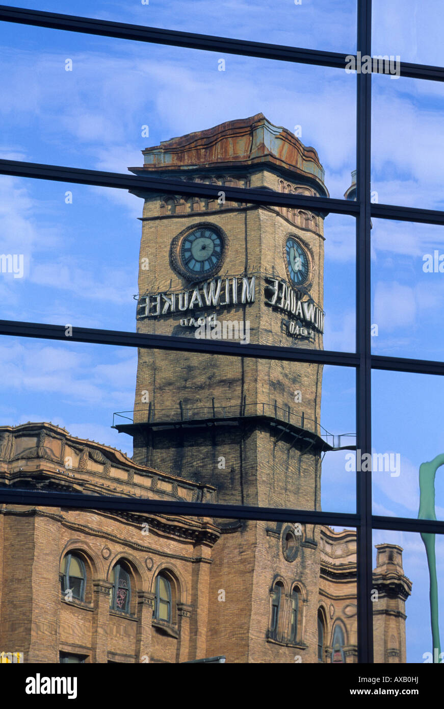 REFLECTION OF HISTORIC MILWAUKEE ROAD DEPOT IN OFFICE BUILDING WINDOW. MINNEAPOLIS, MINNESOTA