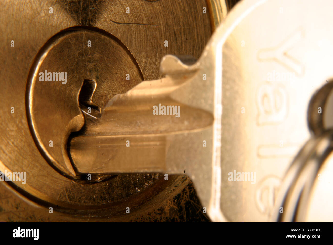 A macro shot of a key sticking out of a lock Stock Photo Alamy