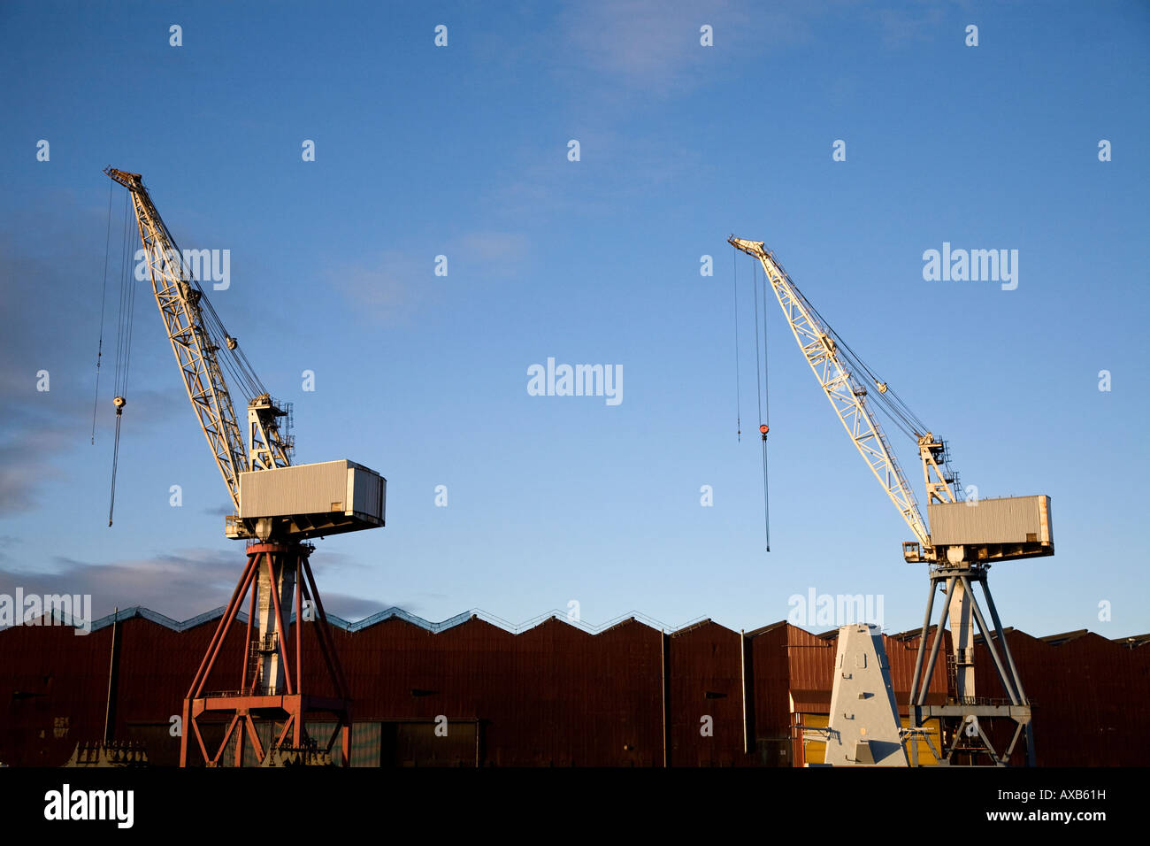 Heavy lifting cranes in the BAE Systems ship yard on the river Clyde Glasgow UK Stock Photo