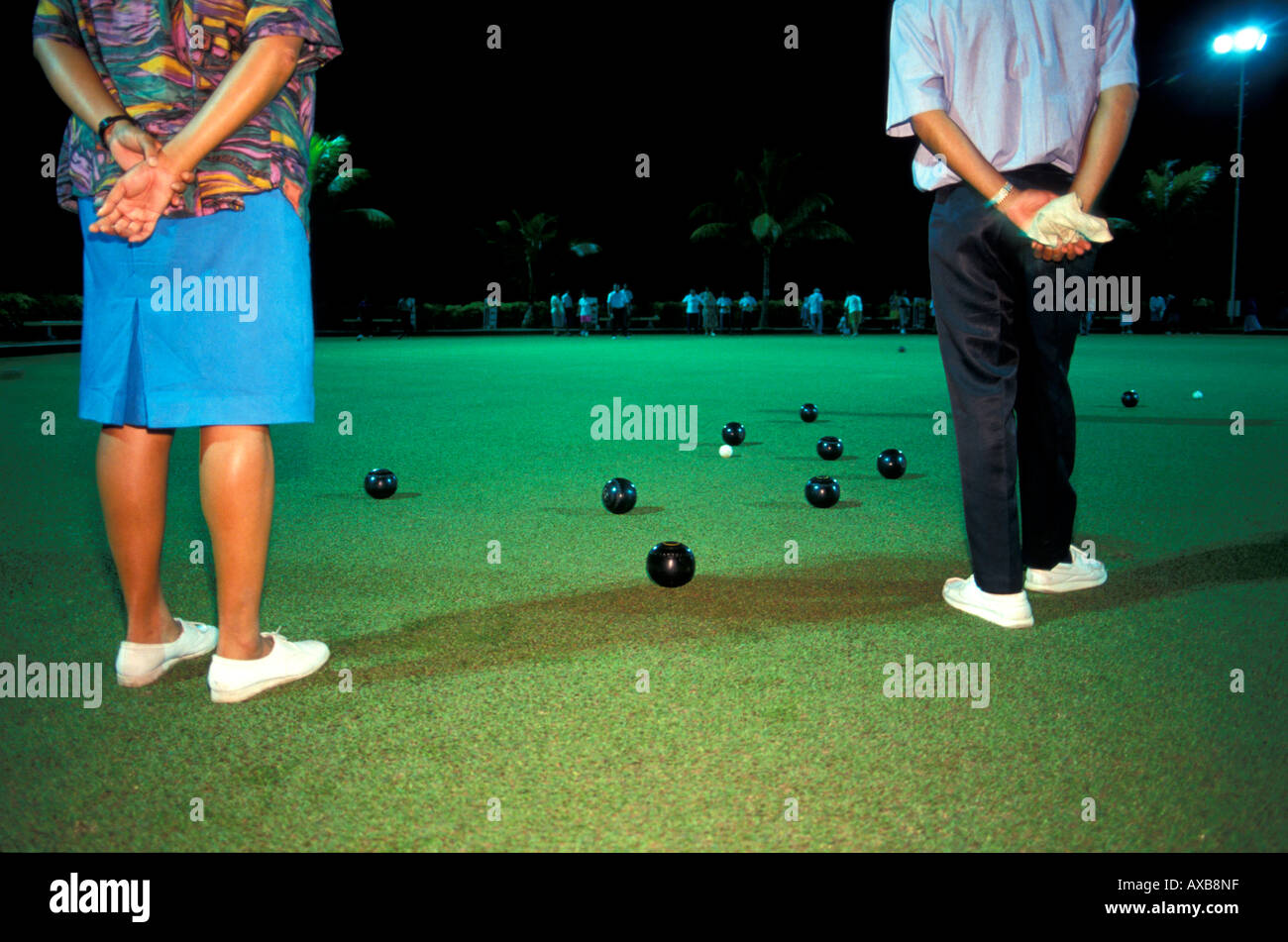 Two people playing lawn bowls, Suva, Fiji Island, Polynesia Stock Photo