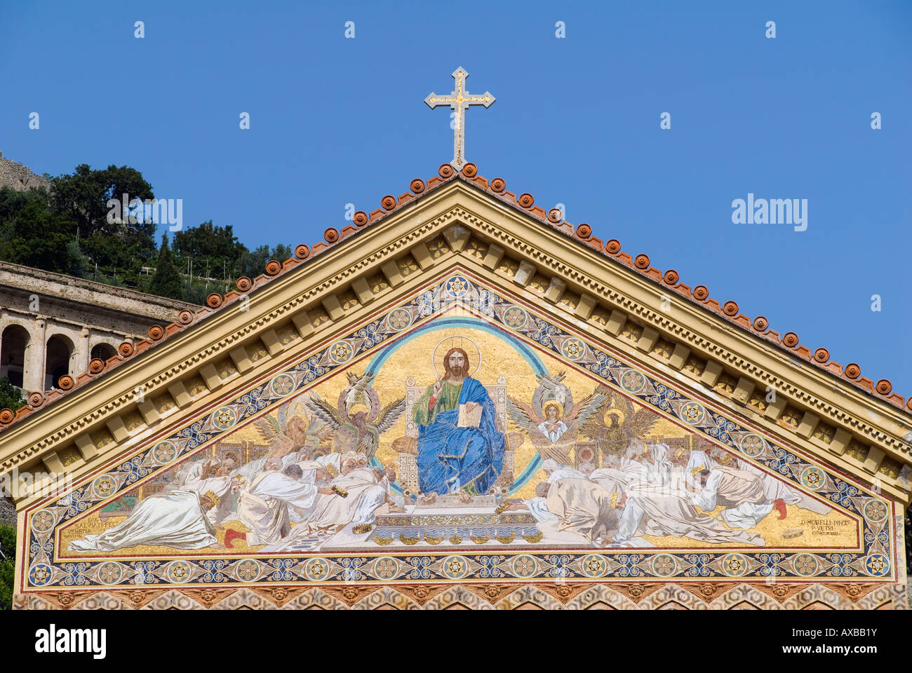 A Christian cross of sits atop a religious mosaic on the Cathedral of Saint Andrew in Amalfi, Campania, Italy Stock Photo