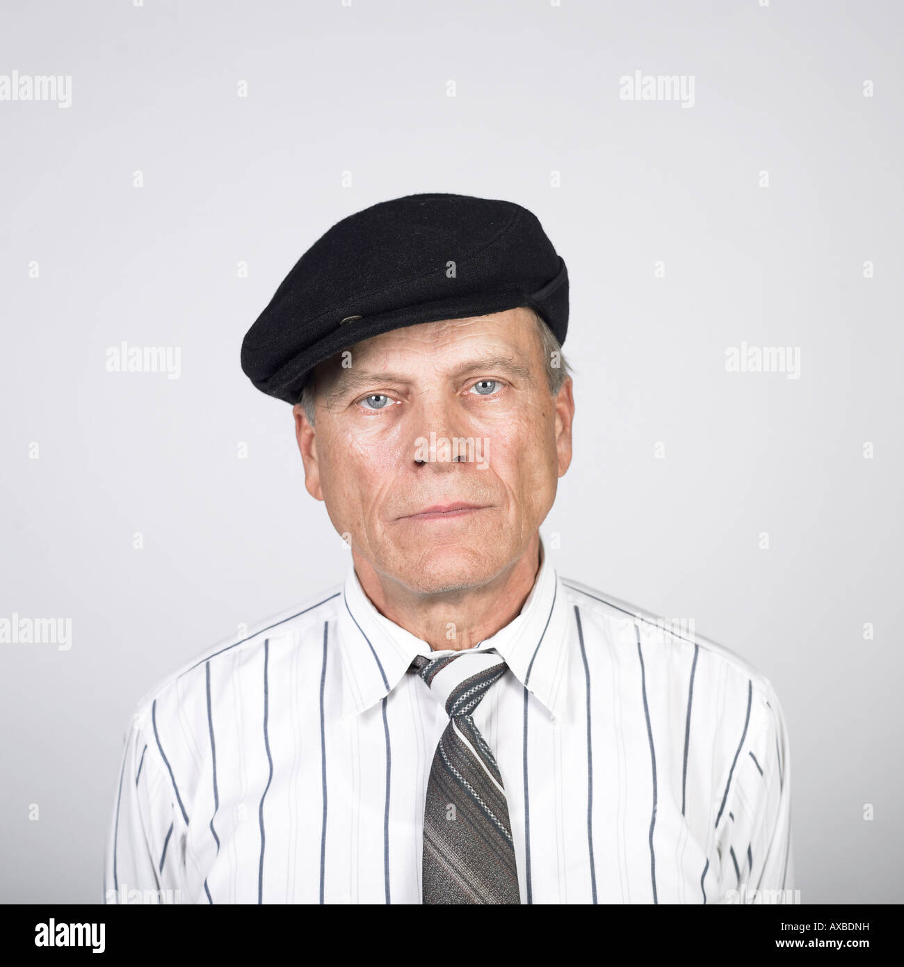 Portrait of man in a white shirt and tie and hat. Stock Photo