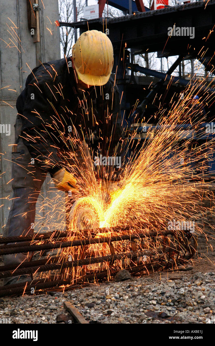 Construction worker cutting metal with a circular saw Stock Photo Alamy