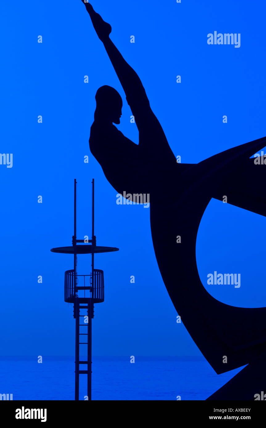Silhouette of a sculpture Homenatge a la Natacio by Alfredo Lanz on Sant Sebastia beach Barcelona Catalunya Spain Stock Photo