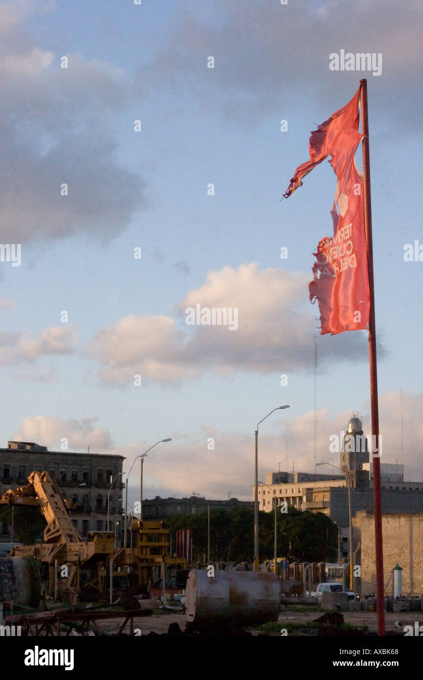 Torn flag flying in the Ciudad Vieja at dusk Stock Photo