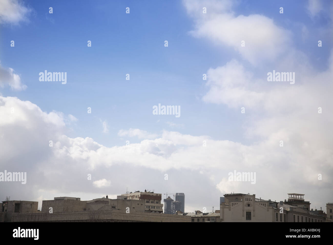 Blue sky and apartment roofs hi-res stock photography and images - Alamy