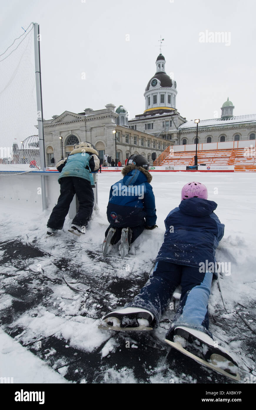 Young skaters wait for the Market Square skating rink to open during