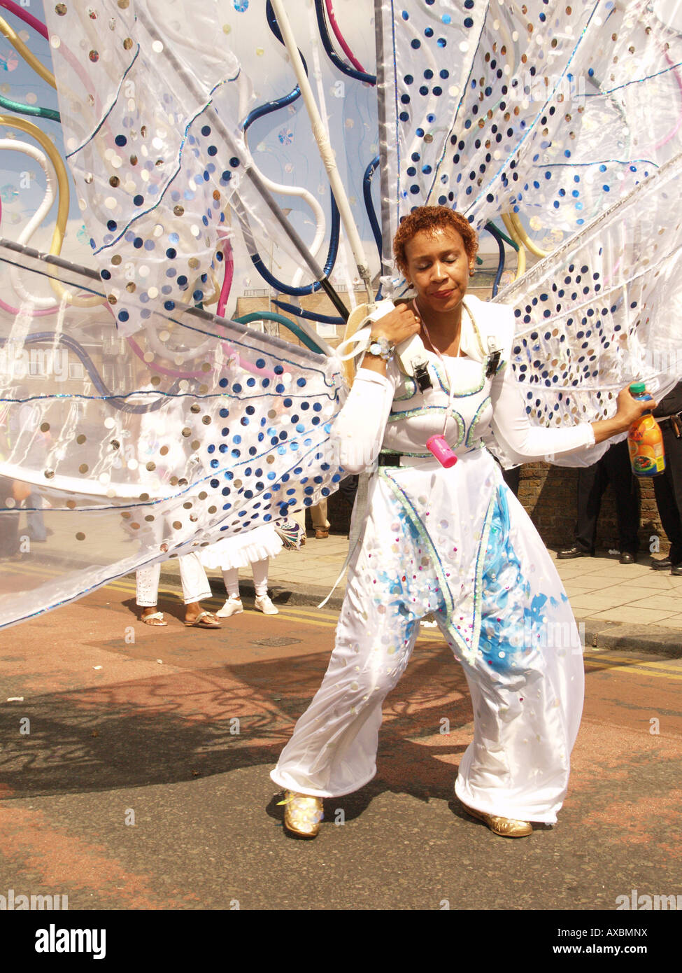 female calypso dancer costume fruit focussed twirl notting hill carnival Stock Photo