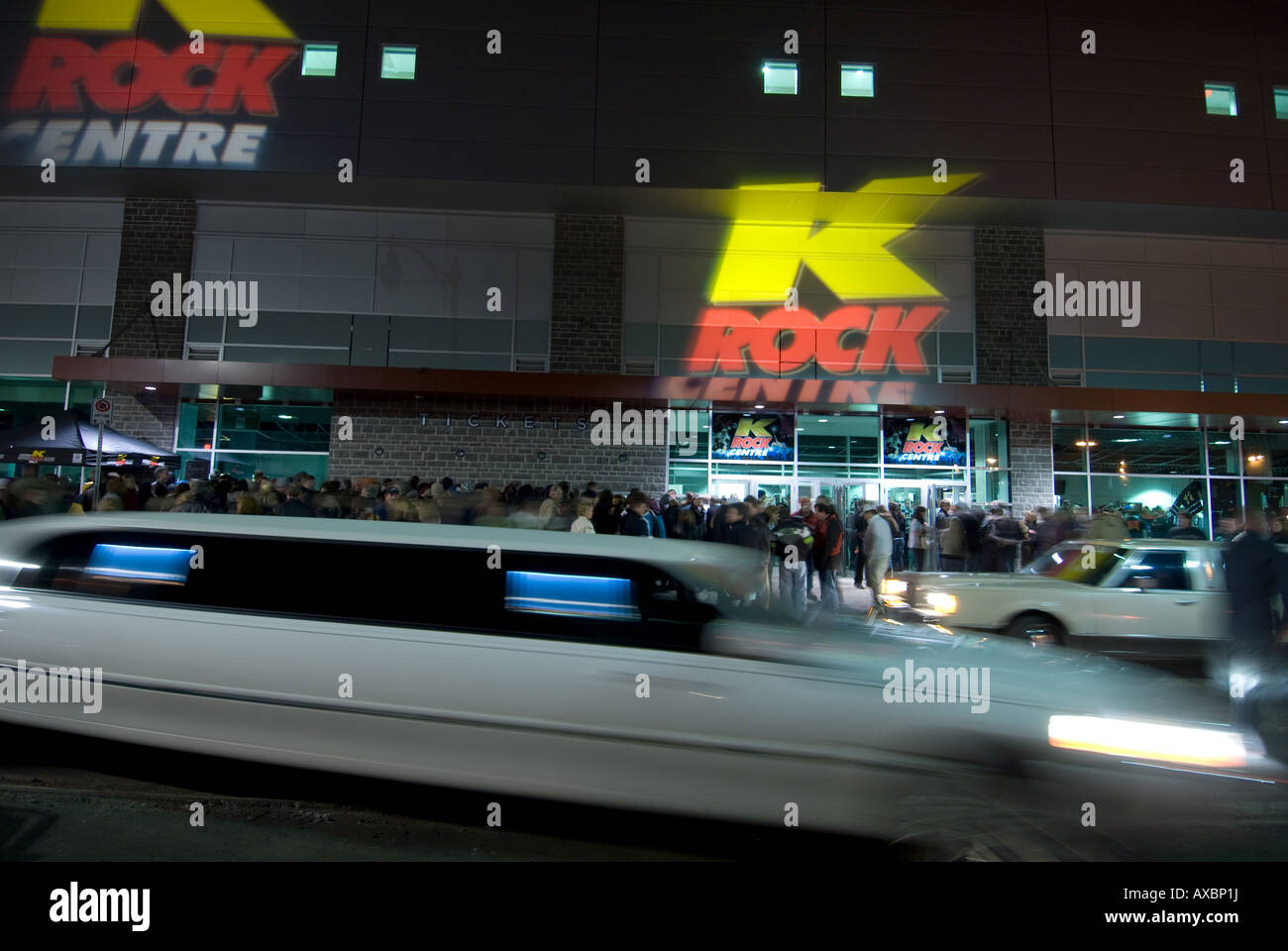Stretch limos sip in and out dropping of concertgoers at the new K Rock Centre for the Tragically Hip Kingston Ontario Feb 23 08 Stock Photo