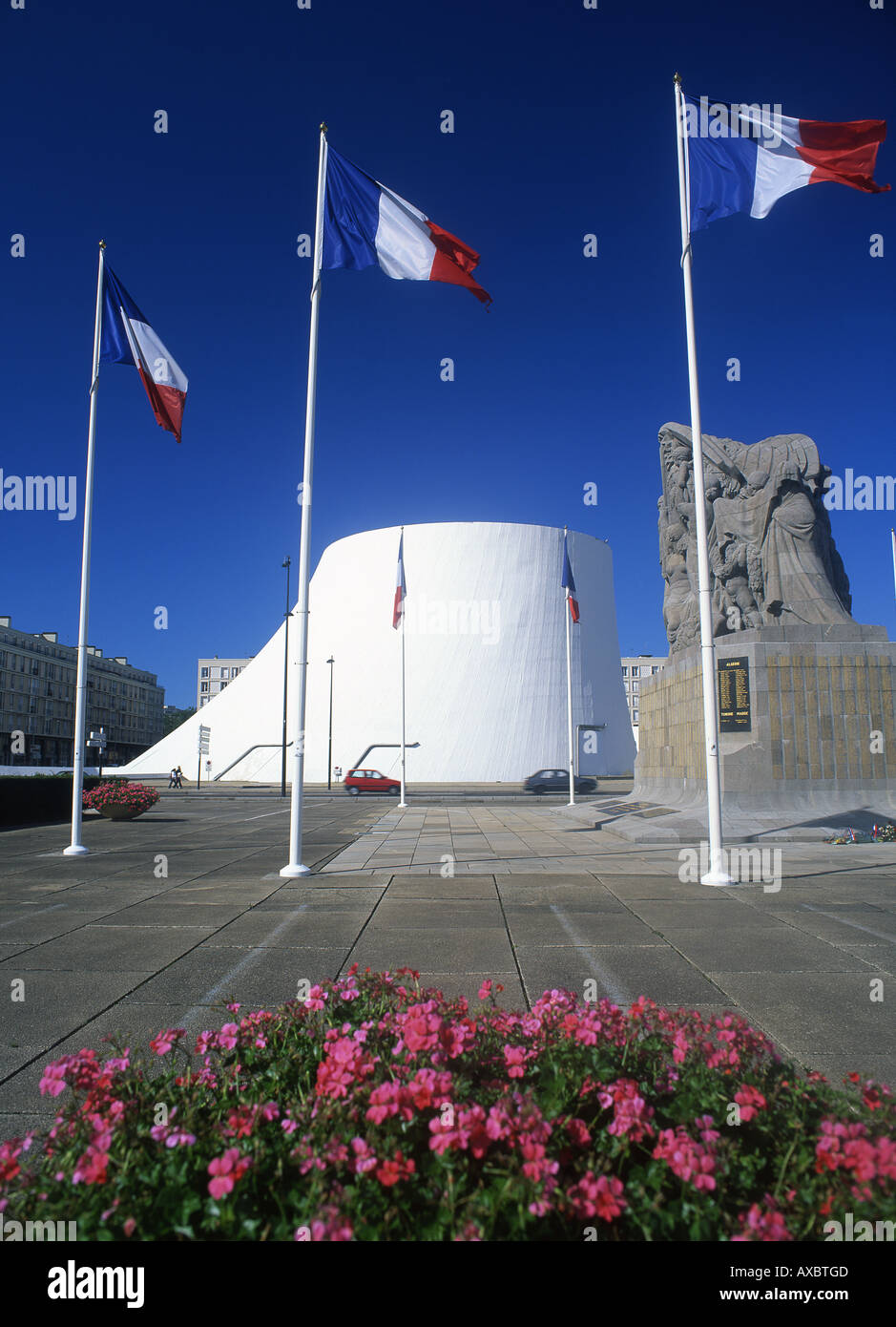 Volcano Building,war memorial and French flags Espace Oscar Niemeyer Le Havre Seine-Maritime Normandy France Stock Photo