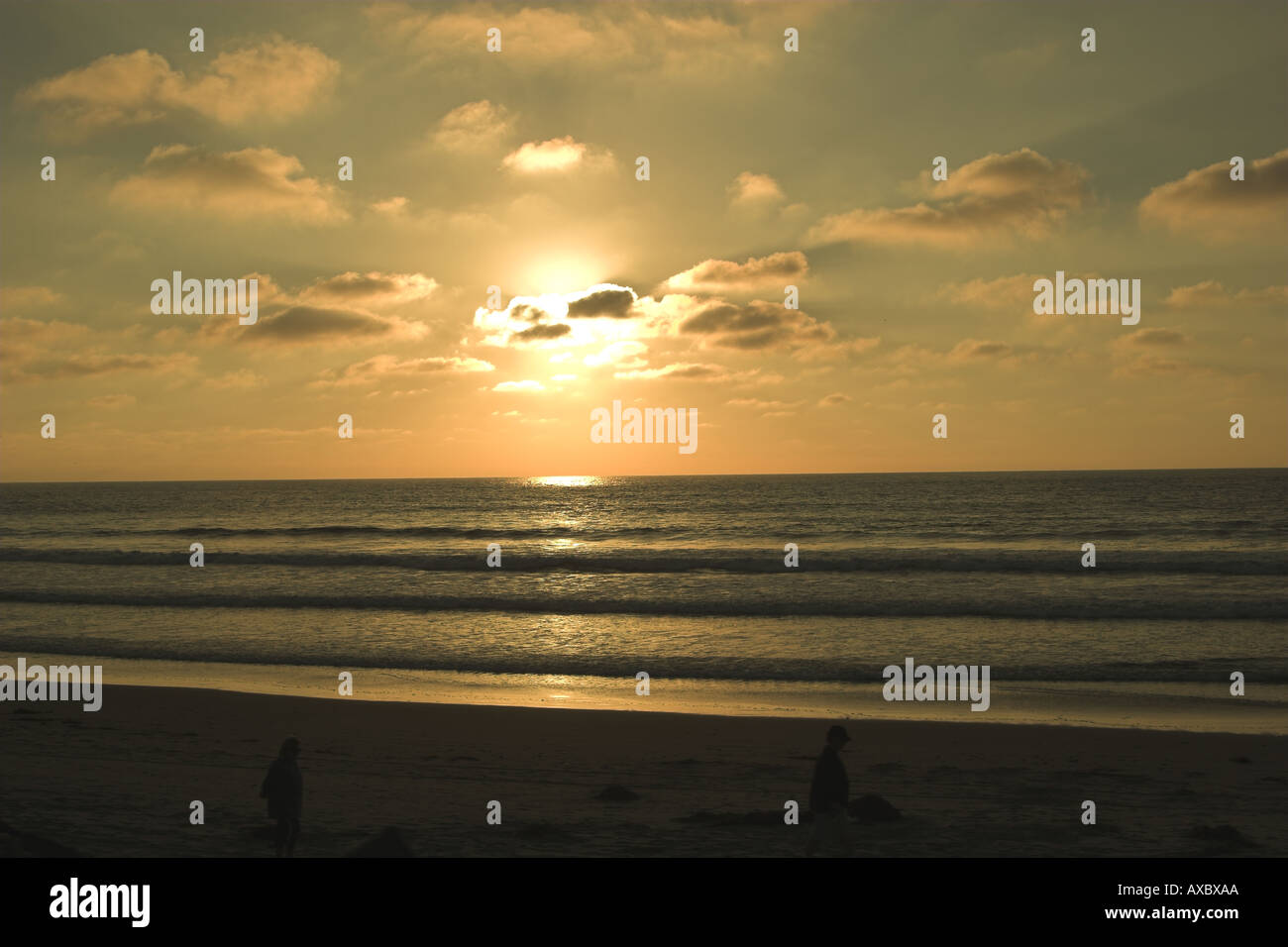 Sunset on beach Stock Photo - Alamy