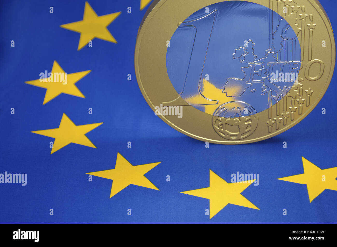 Euro coin on European flag Stock Photo