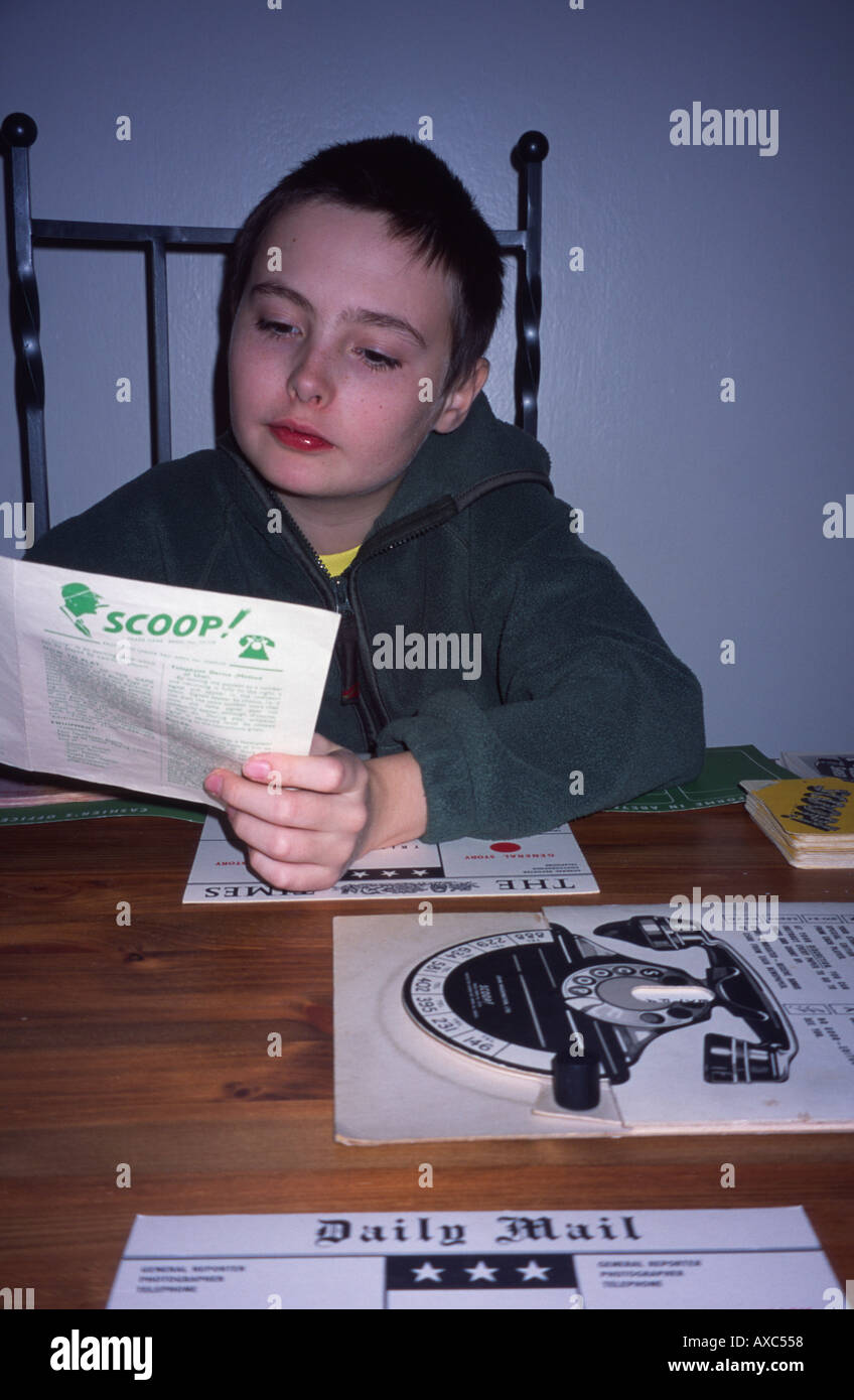 Boy playing Scoop board game London, England UK Stock Photo Alamy