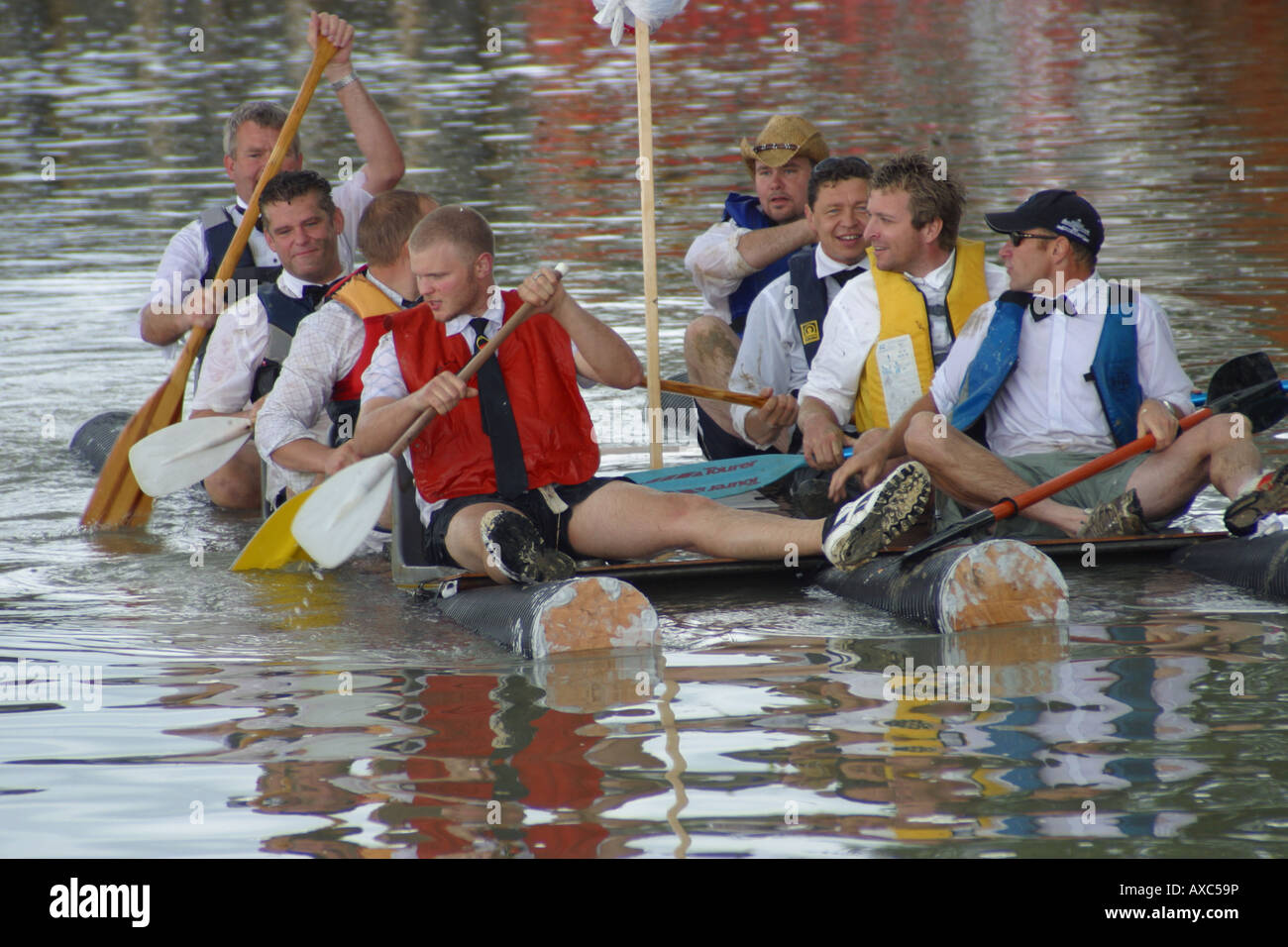 raft race competitors rowing river paddles water Stock Photo - Alamy