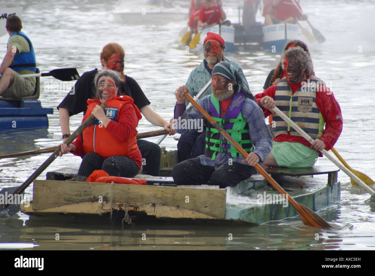 raft race competitors rowing river paddles water Stock Photo - Alamy