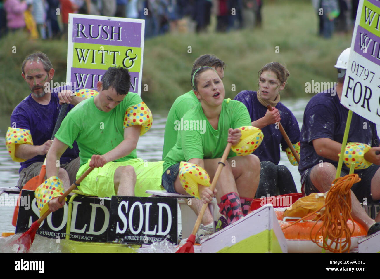 raft race competitors rowing river paddles tired Stock Photo - Alamy