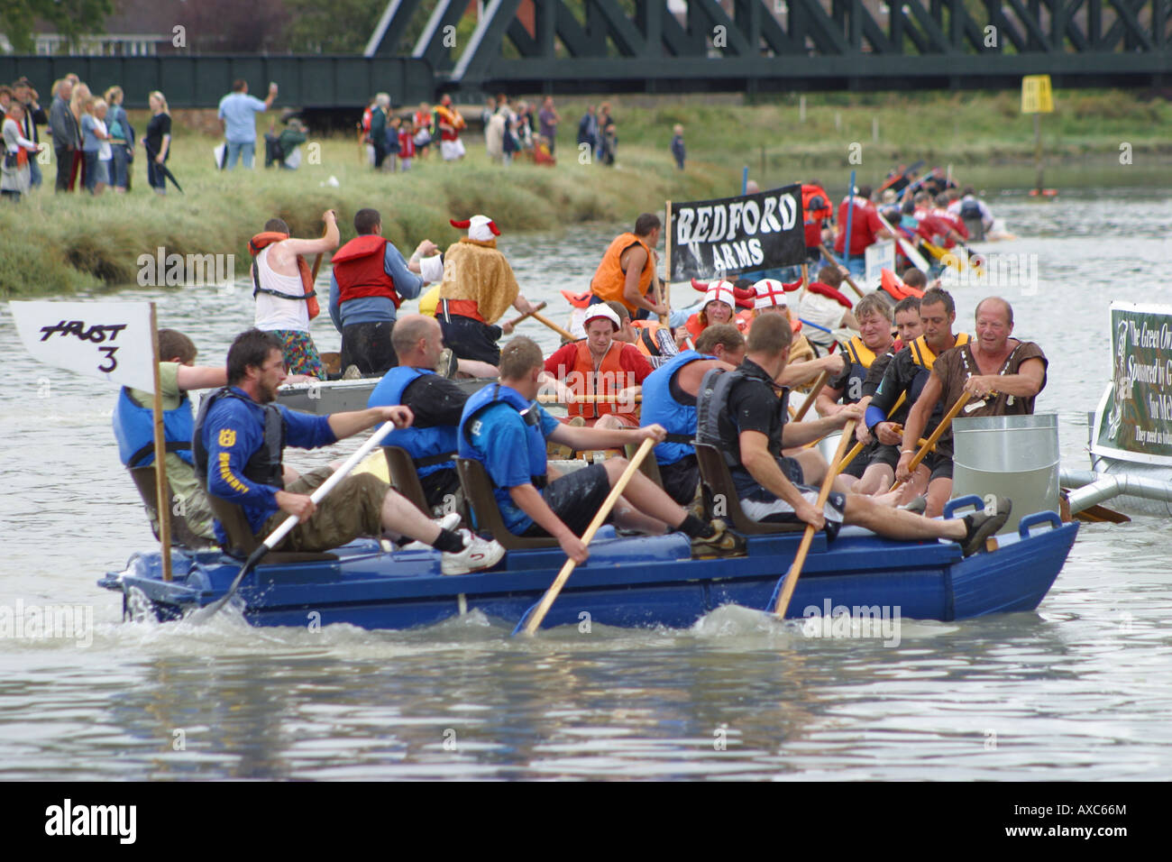 raft race competitors rowing river paddles water Stock Photo - Alamy