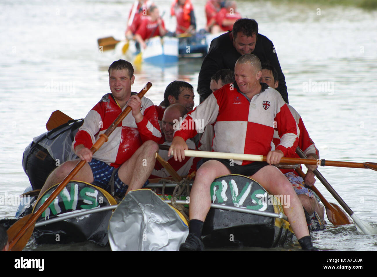 raft race competitors rowing river paddles water Stock Photo - Alamy