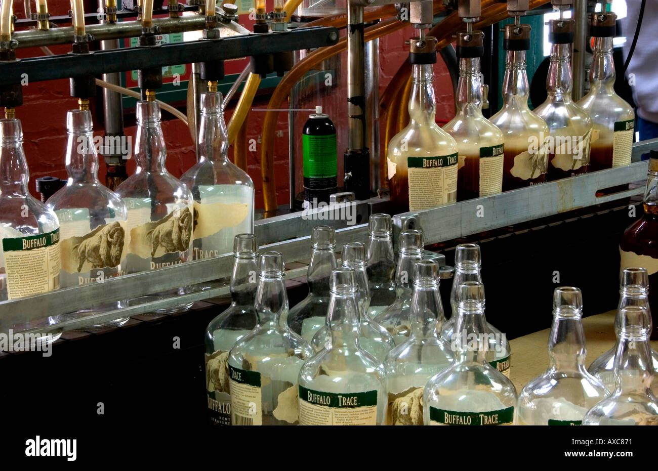 Filling line running with bottles of Kentucky bourbon whiskey at Buffalo Trace distillery in Frankfort Kentucky Stock Photo