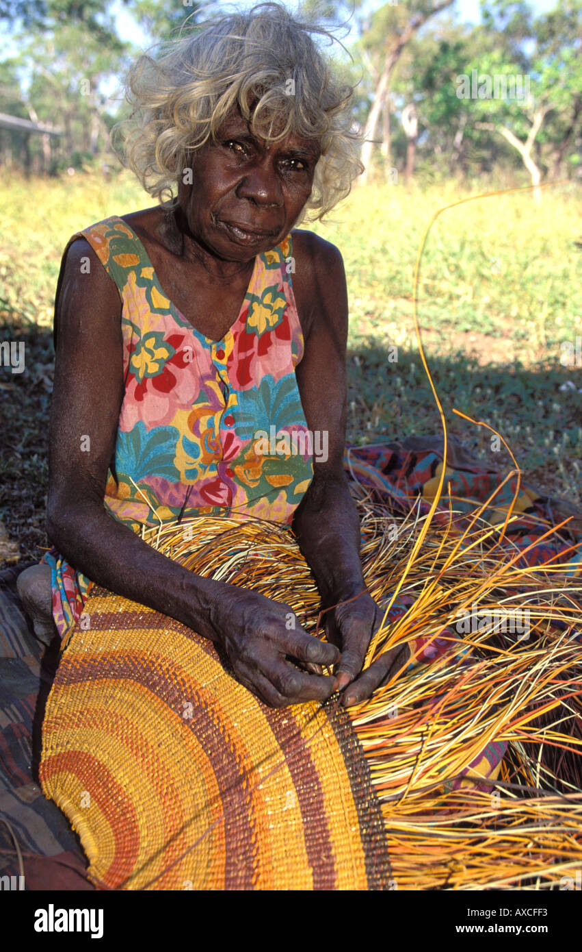 Aboriginal granny Rogie Wudam weaving a traditional pandanus mat Stock