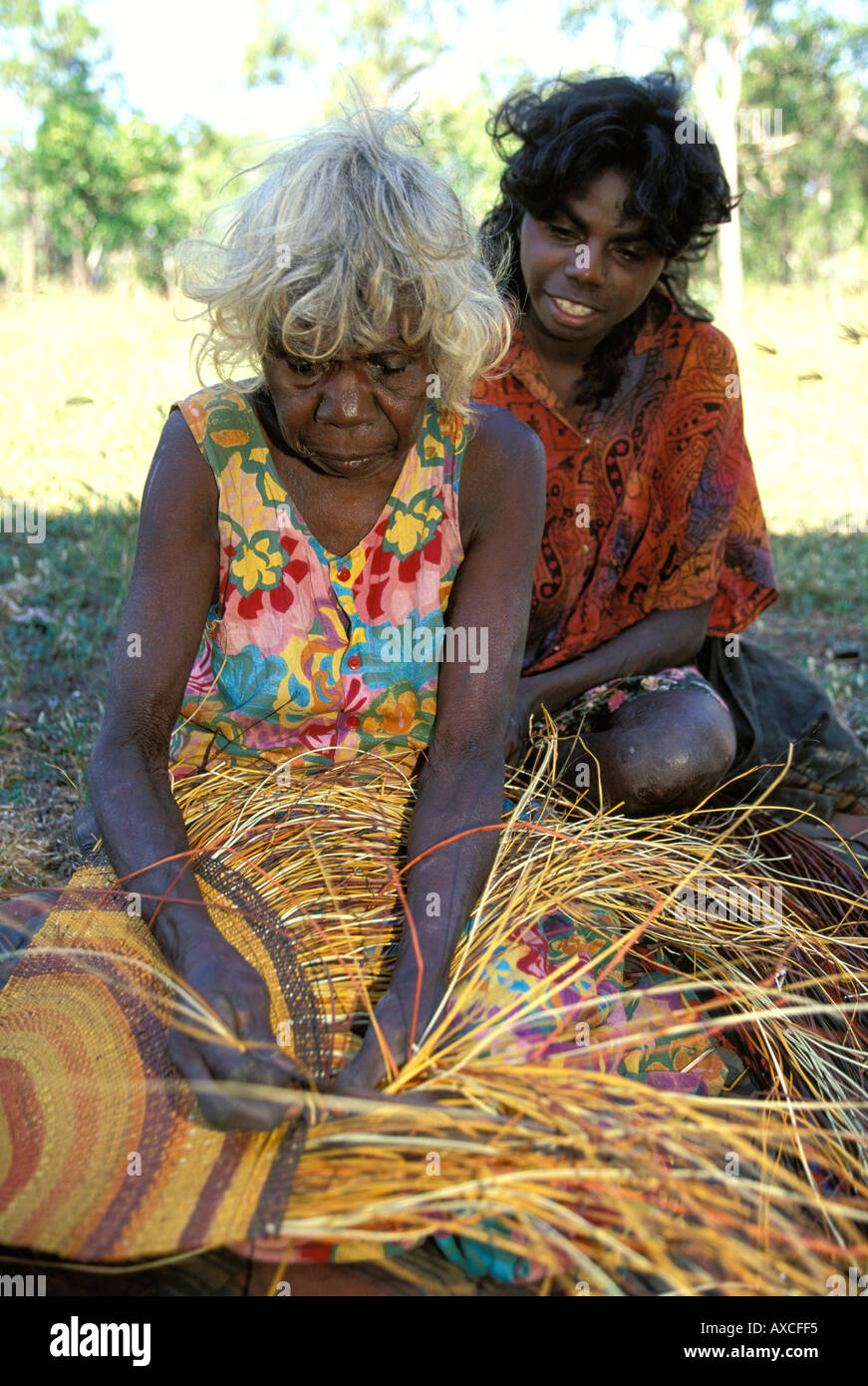 Rogie Wudam teaches her neice how to weave a pandanus mat at Yathalamarra outstation Arnhem Land