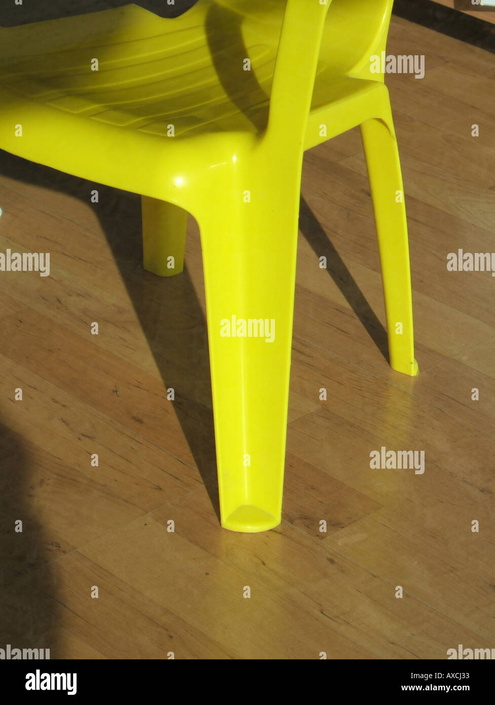 yellow plastic chair Stock Photo Alamy