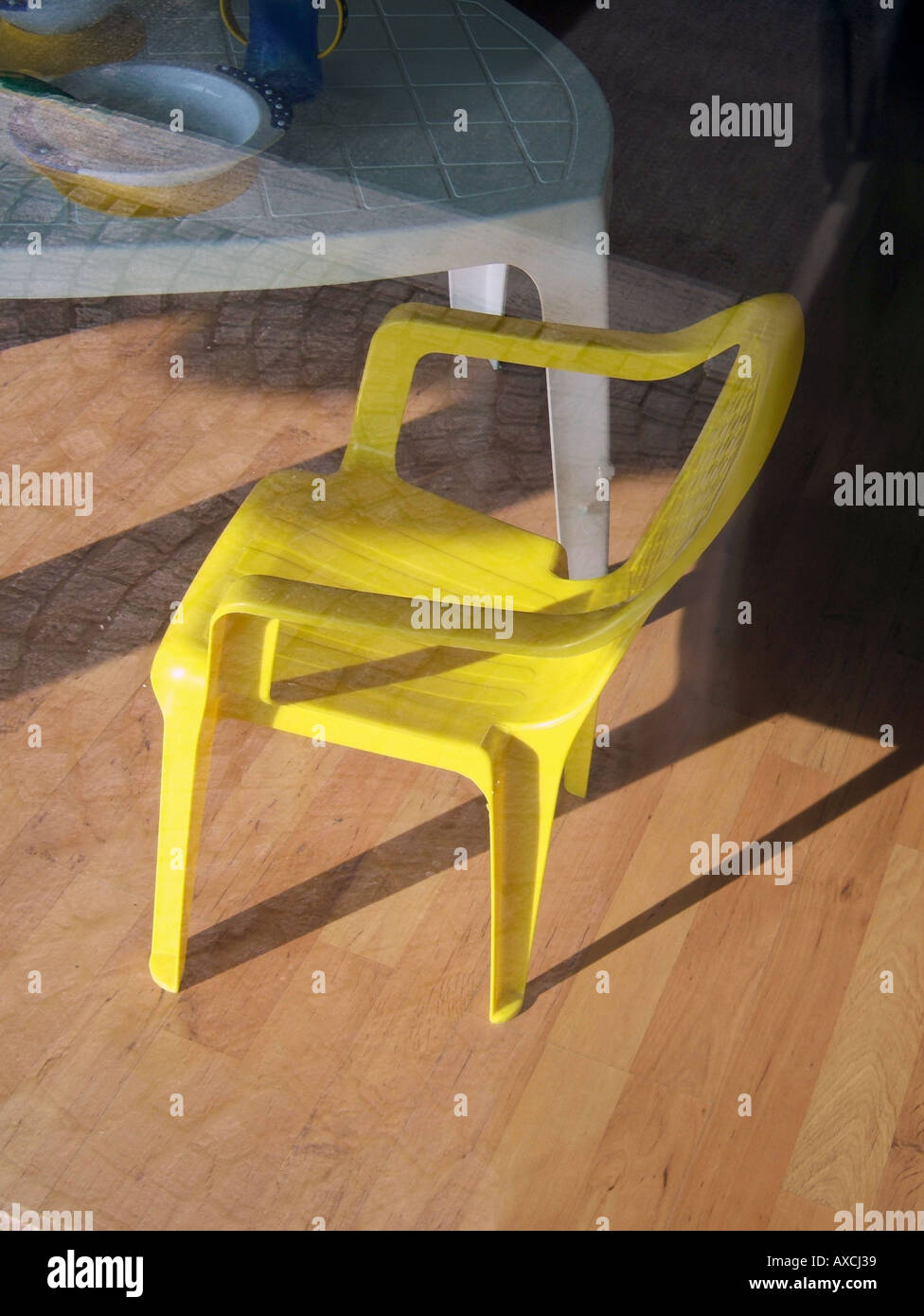 yellow plastic chair Stock Photo Alamy