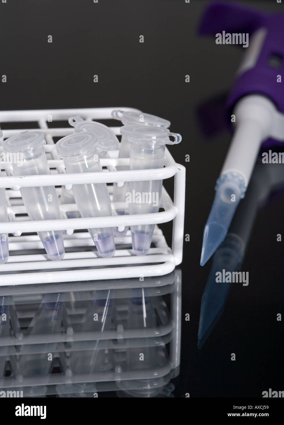 Test tubes and pipette on dark background Stock Photo