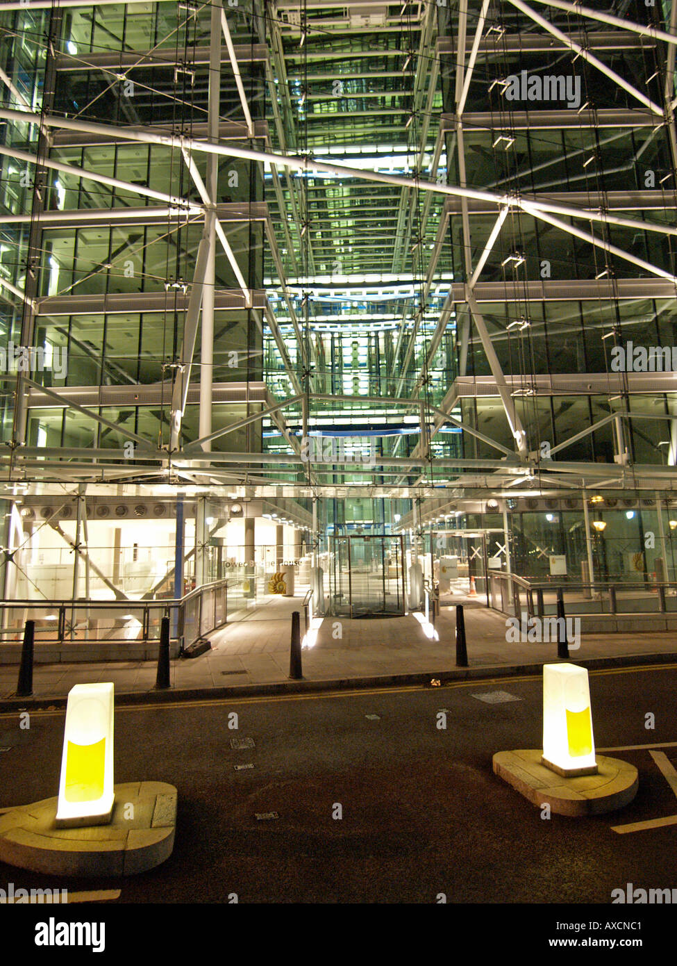 Towerbridge house entrance at night ultra modern architecture glass industrial offices London UK Stock Photo
