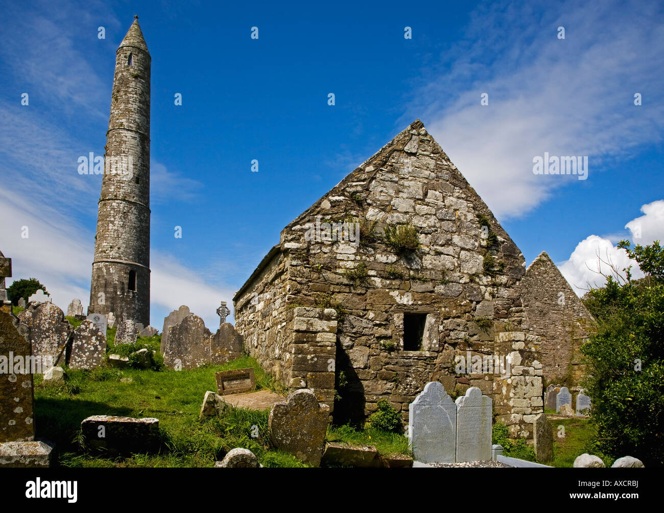 St Declan's 5th Century Monastic Site with the  Round Tower and St Declan's Oratory, Ardmore, County Waterford, Ireland Stock Photo