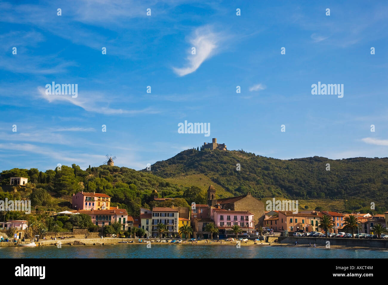 Fort St. Elme on the distant hill, fronted by the Beach at Collioure, Pyrenees-Orientales, France Stock Photo