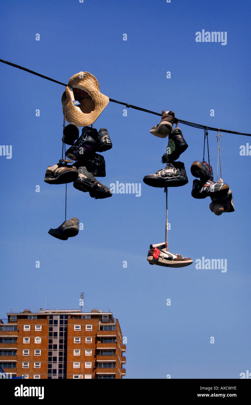 Shoes hanging from power lines in the North Laine district of Brighton,  East Sussex. Picture by Jim Holden Stock Photo - Alamy