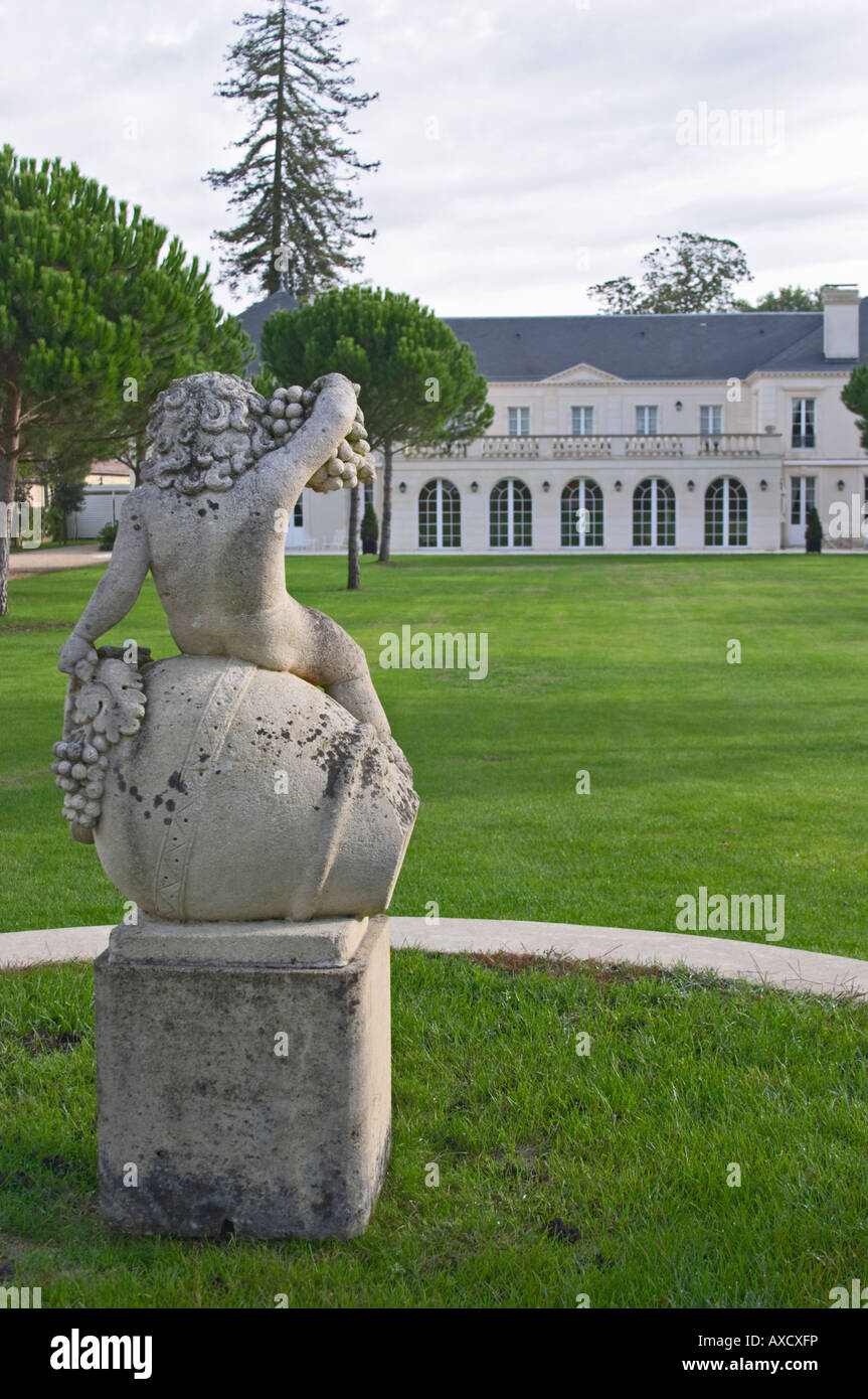 Statue of Bacchus, grape bunch. In the garden. Chateau Malartic Lagraviere, Pessac Leognan, Graves, Bordeaux, France Stock Photo