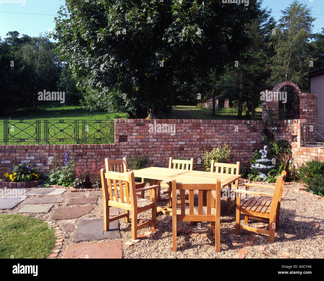 Wooden garden table and chairs on patio Stock Photo Alamy