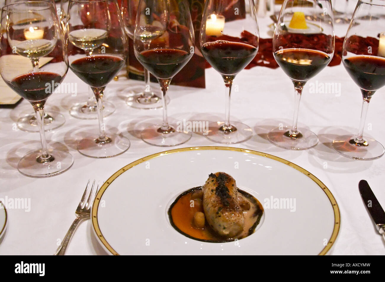 Dinner in the George V luxury restaurant in Paris. Boudin blanc white blood sausage. Paris, France. Wine tasting. Wine glasses. Stock Photo