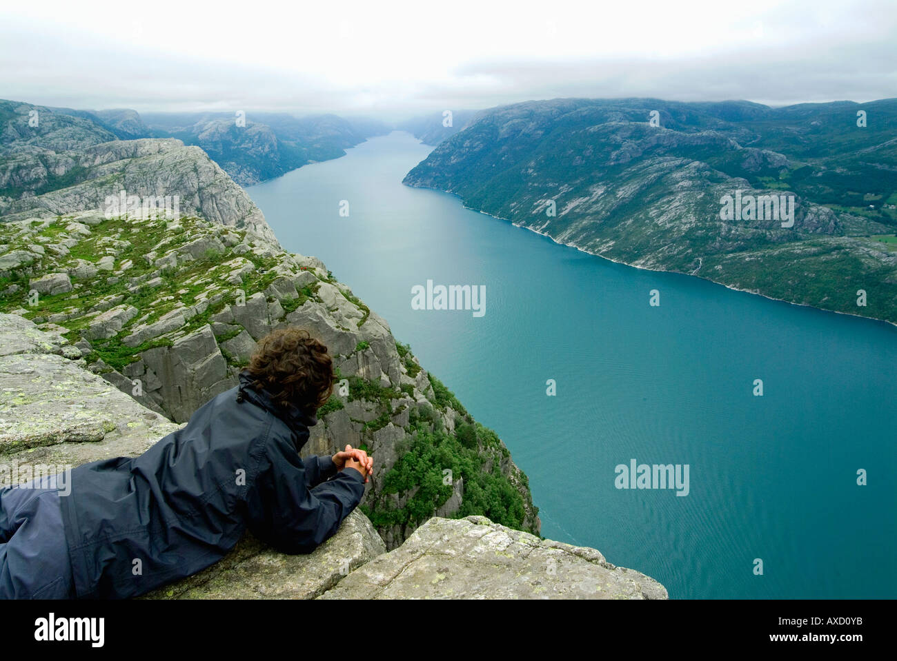 Woman contemplating Lysefjord from Preikestolen.Pulpit Rock.Norway Stock Photo