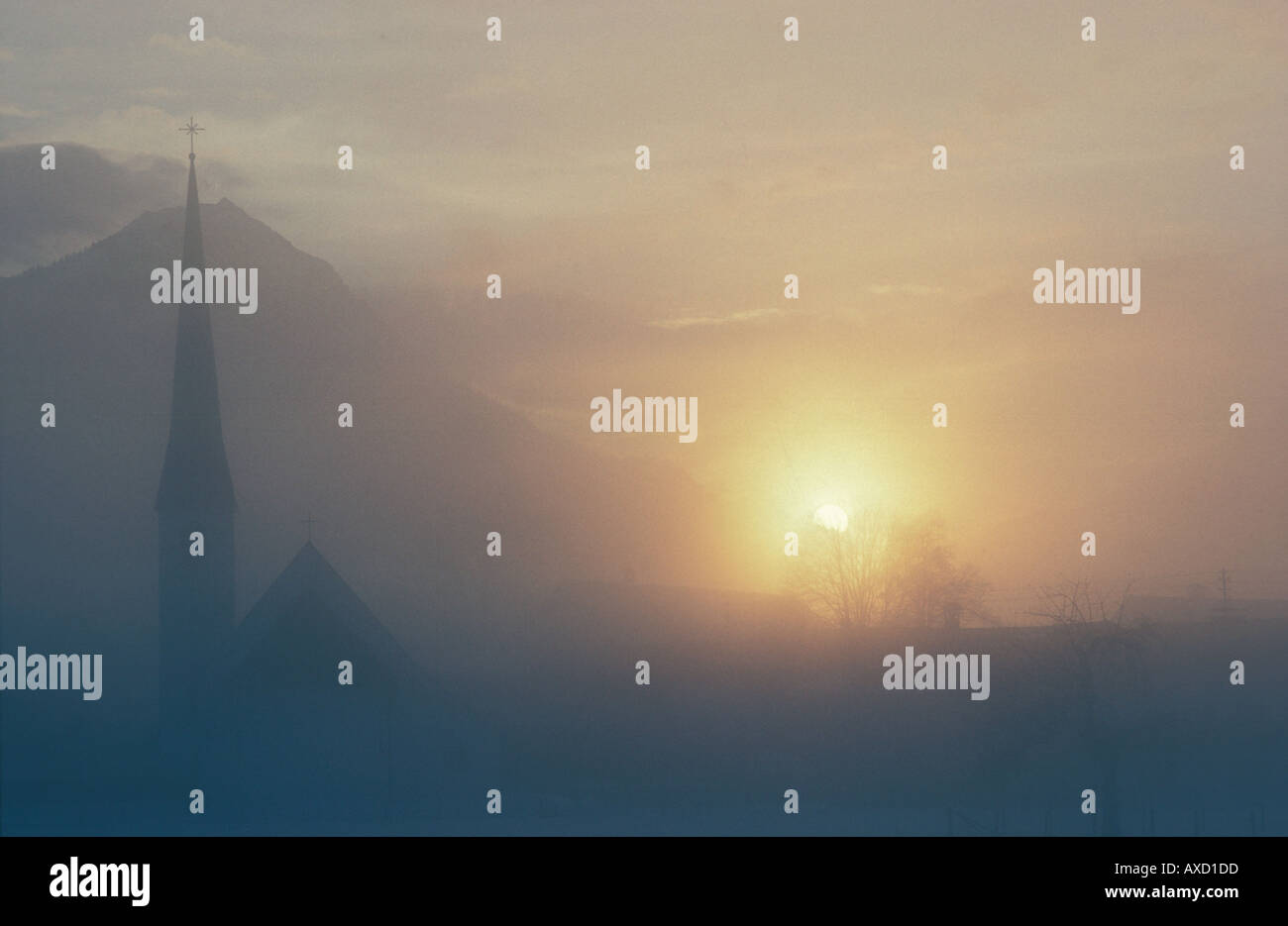 Europe Germany Bavaria Oberammergau sunset fog church chapel bavarian Alps mountainssilhouette snow weather atmosphere Stock Photo