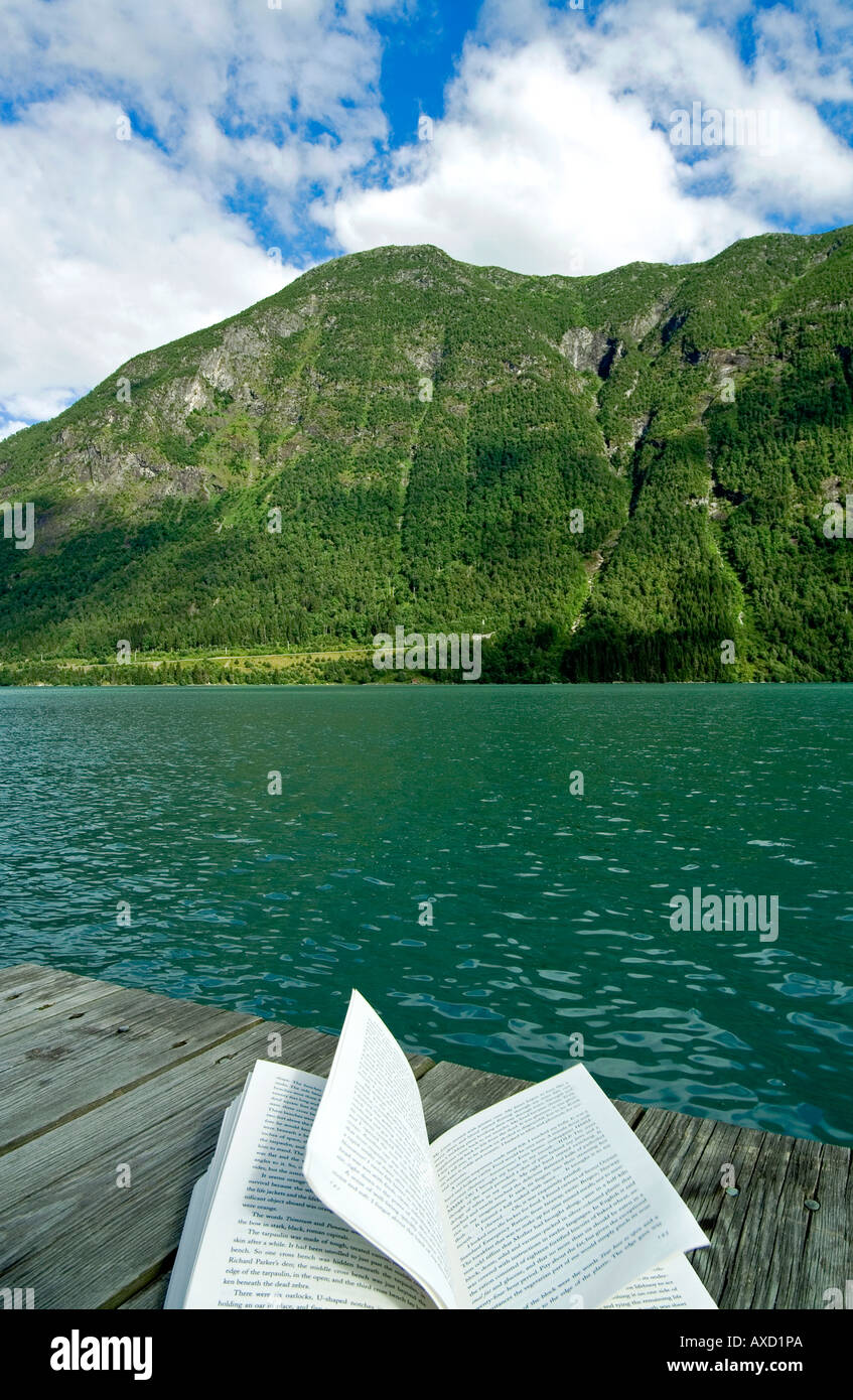 Reading a book.Mundal.Fjaerland fjord.Jostedalsbreen National Park
