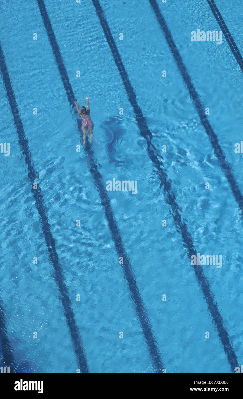Aerial image of young woman swimming in outdoors pool Stock Photo - Alamy