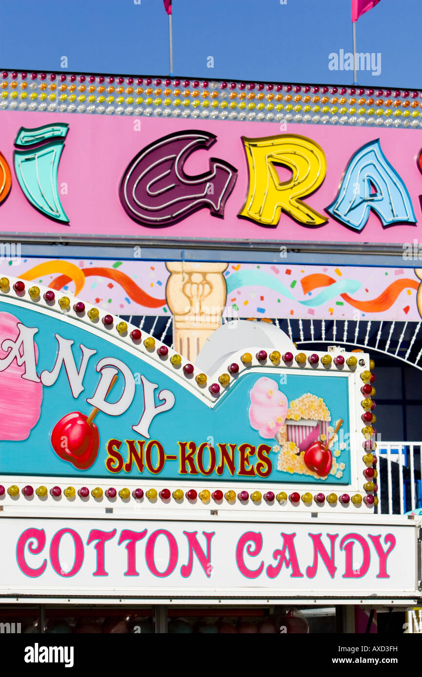 Sno Kone (snow cone) and cotton candy sign at carnival in USA Stock Photo