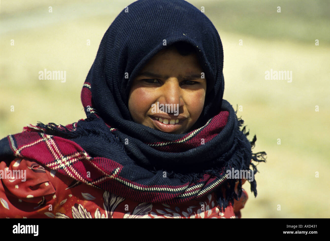 Portrait of a Bedouin girl wearing a veil, Jordan. Stock Photo