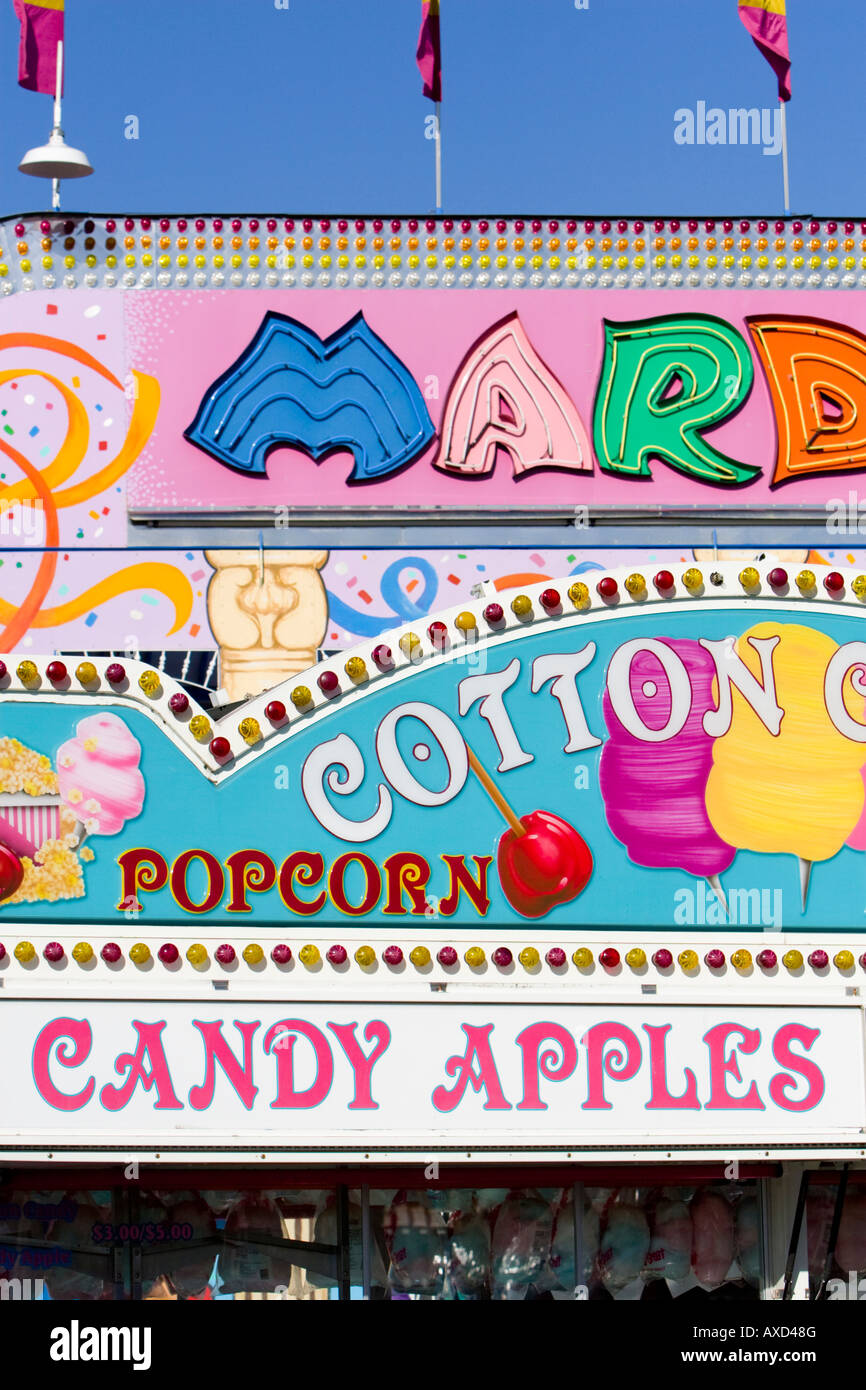 Popcorn and candy apples sign at carnival in USA Stock Photo