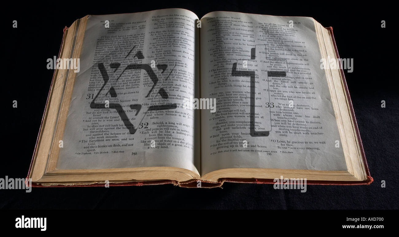 Bible with Jewish Star  & Christian Cross Symbols Stock Photo